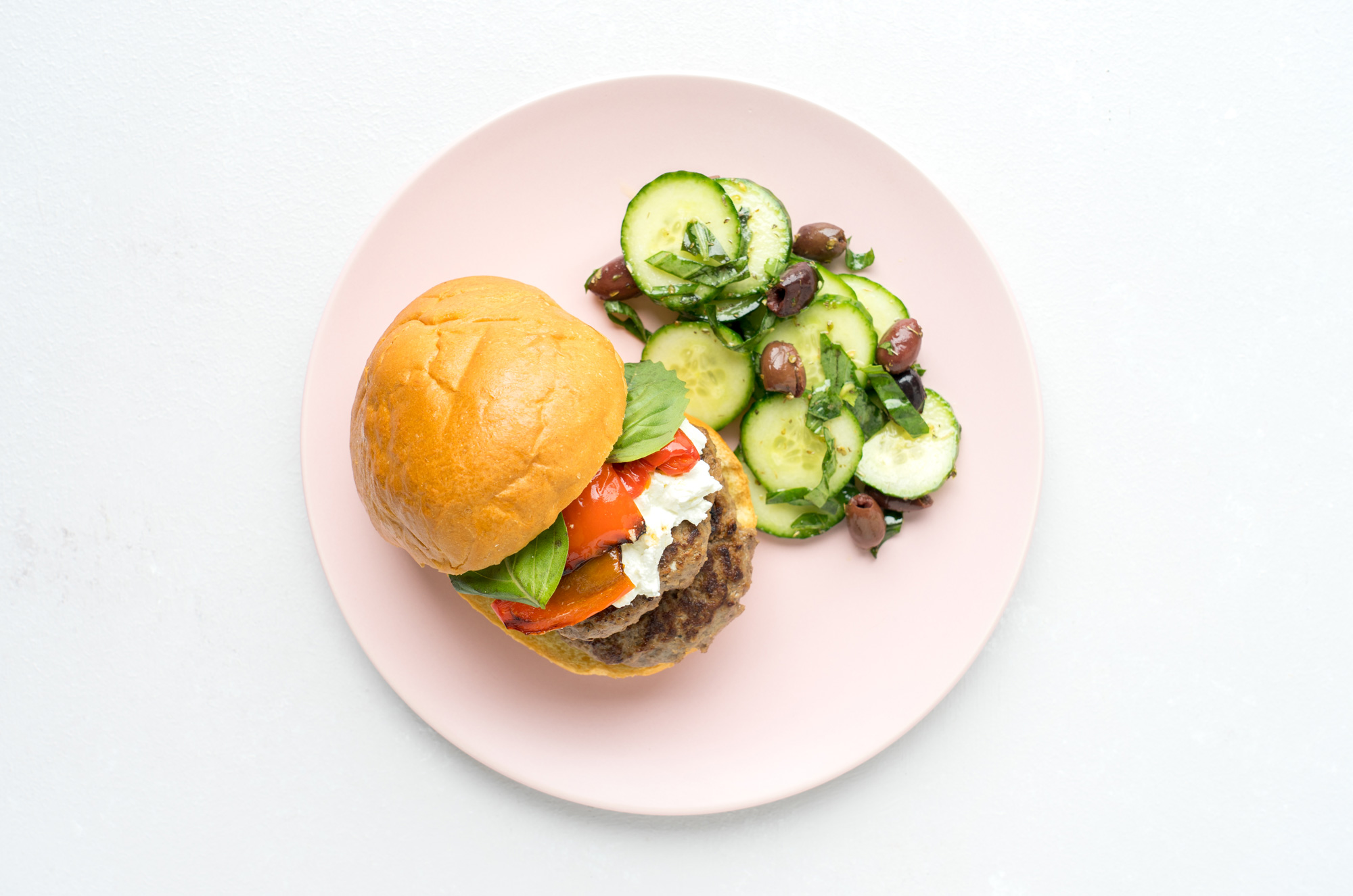 Lamb Burgers with Feta Sauce, Roasted Peppers, Cucumber Salad
